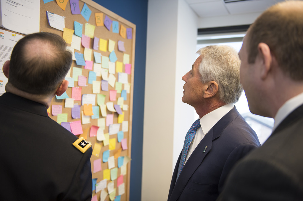 Secretary of Defense Chuck Hagel reads messages on the "Hope Board," a board with notes from many of the victims supported by RAINN